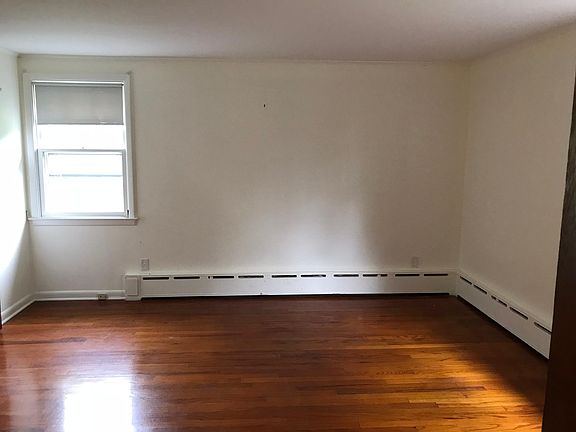 View of bedroom, three windows in bedroom