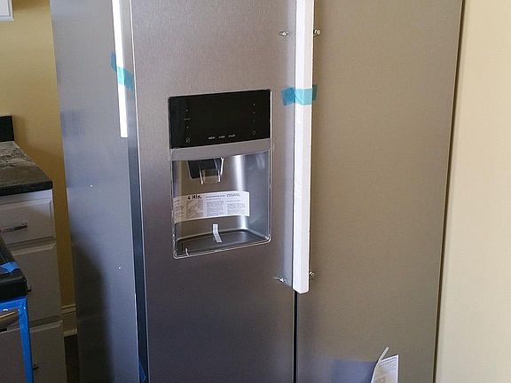 New stainless steel appliances being installed