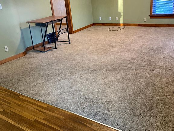 Large living room on front side of duplex
