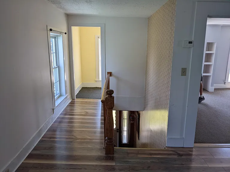 Unit B entryway. Hallway leads to a large closet.