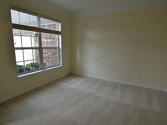 Across from the formal dining room is a formal living area.