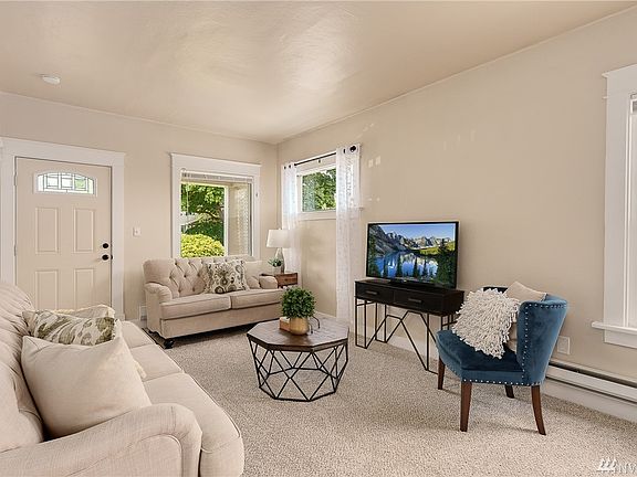 Vintage high ceilings and white painted millwork add to the charm.