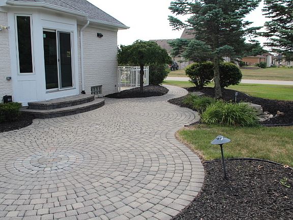 Back yard brick paver patio off kitchen