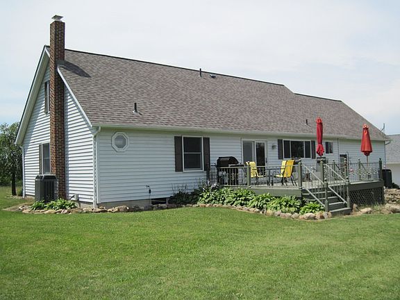 Back of home with large deck