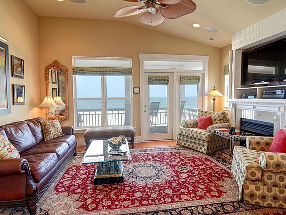 Spacious oceanfront living room with large deck