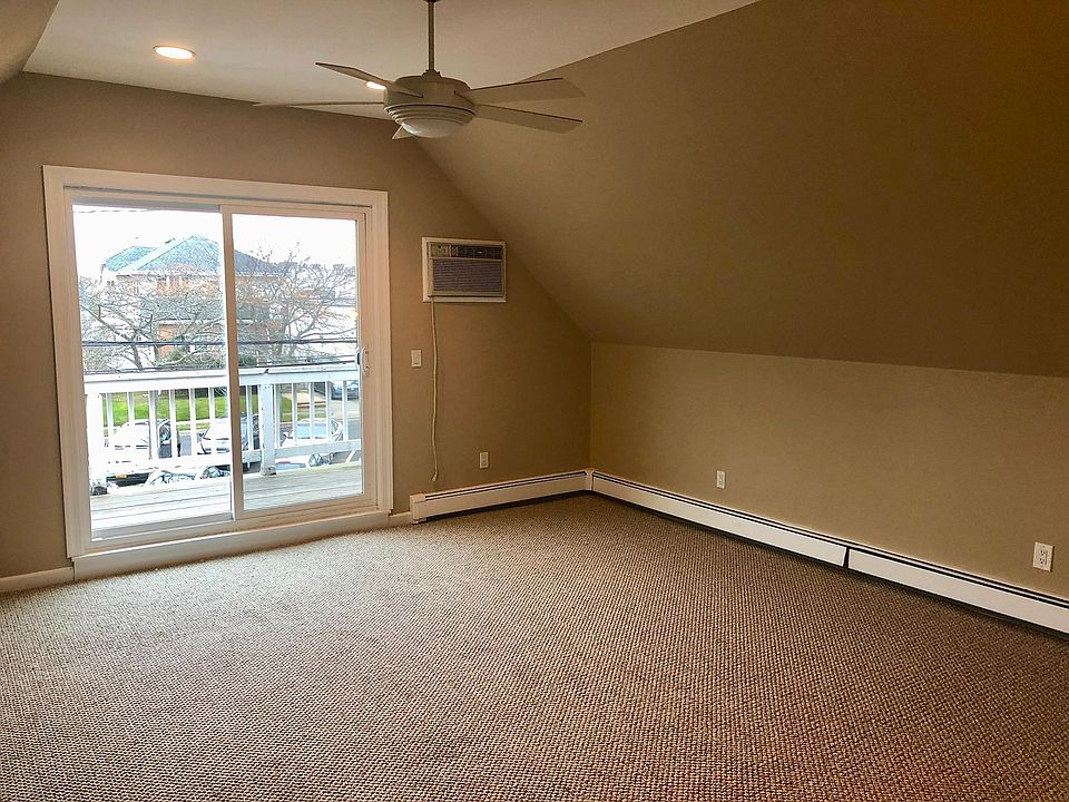 Living room with sliding French doors to private deck.