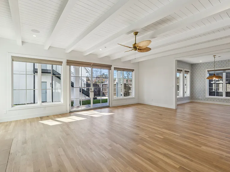 living room looking out at back yard and studio apartment and garage