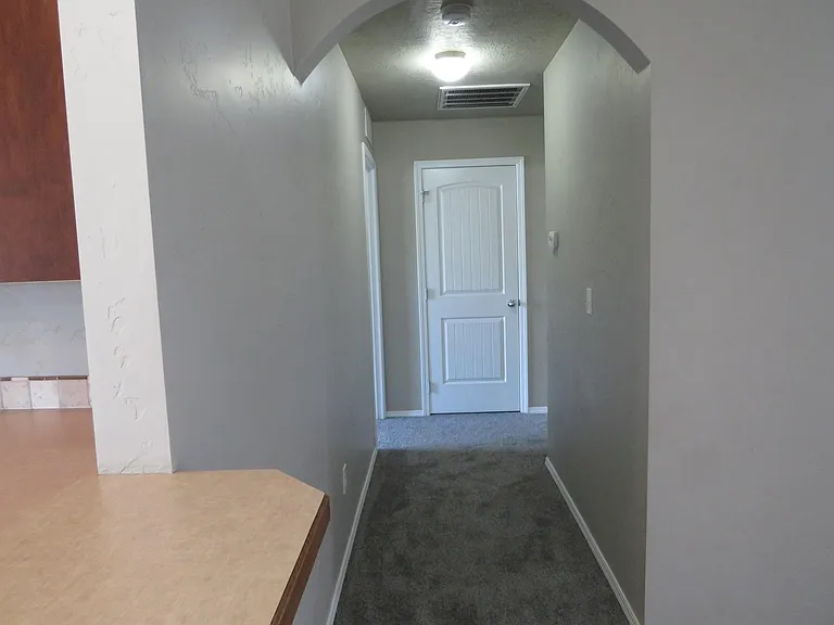 Hallway view of coat closet
