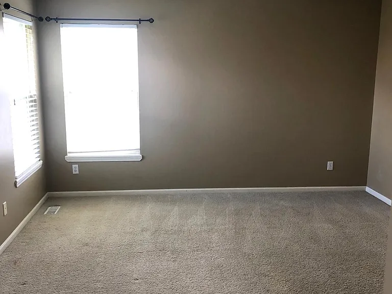 Primary Bedroom with ceiling fan