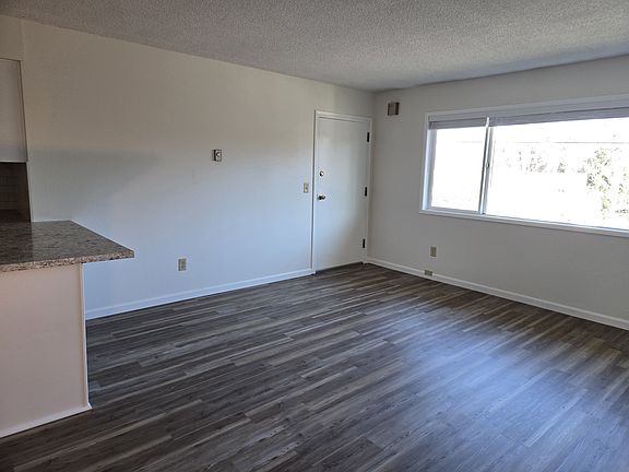 Large lining room windows with natural light.