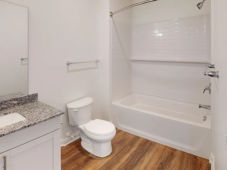The Roth bathroom features a granite vanity and full shower and bathtub. The Roth bathroom features a granite vanity and full shower and bathtub.