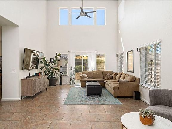 Living room high ceilings - glass door opens for backyard access