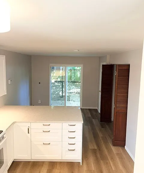 Sliding glass doors lead out to your private, fully fenced backyard.