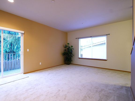 No longer carpeted living room - laminate flooring throughout bottom floor