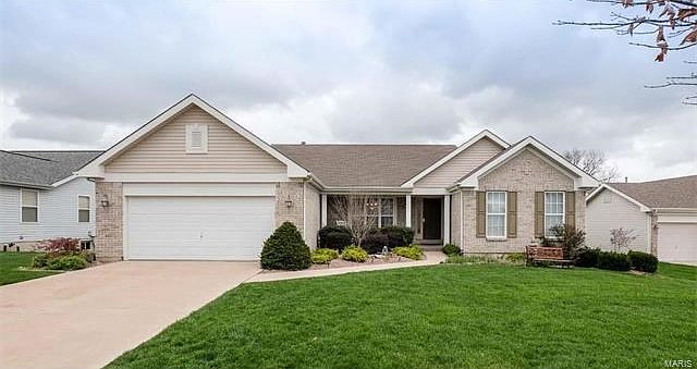 Pretty elevation and professional landscaping.