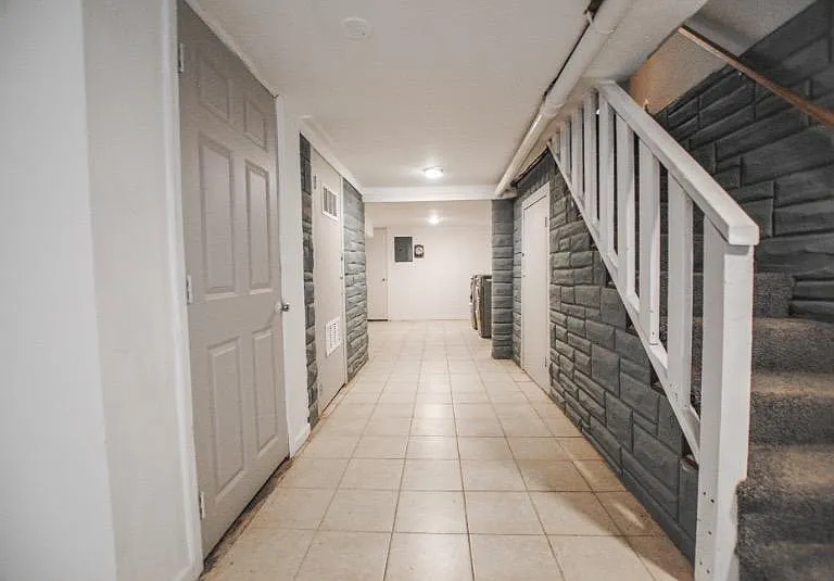 Head downstairs to the finished basement with washer and dryer