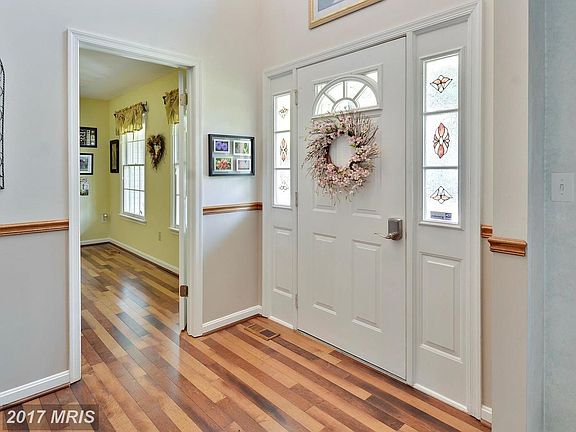 Rich, new wood flooring in 2-Story Foyer