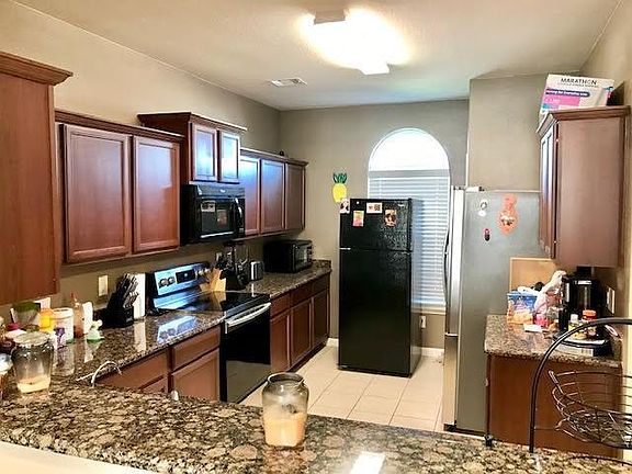 Look at all this cabinet space and nice granite countertops! The seller has an extra refrigerator at this time.