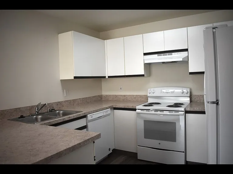 Spacious kitchen! Lots of cupboard and countertop space. Double stainless steel sinks, self cleaning stove, floor to ceiling pantry. So convenient for cooking and baking!