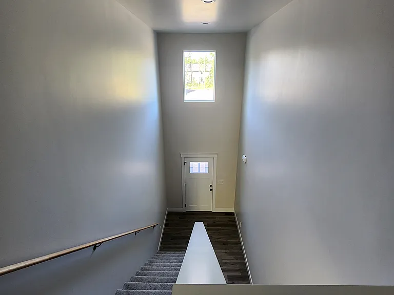 Large, open entryway hallway/stairway