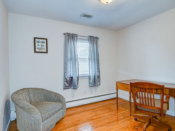 The 3rd bedroom is presented as an office space