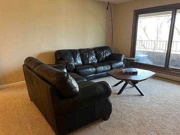 Living room with view of balcony.