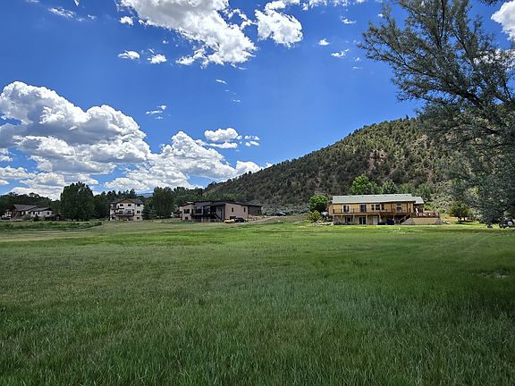 Backyards of subdivision homes - 5 acres per lot. Full deck visible for upper half of home