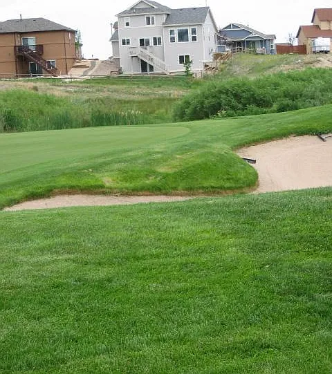 This is the 16th hole. The home is the grey building in the background. A new, larger deck has been installed.