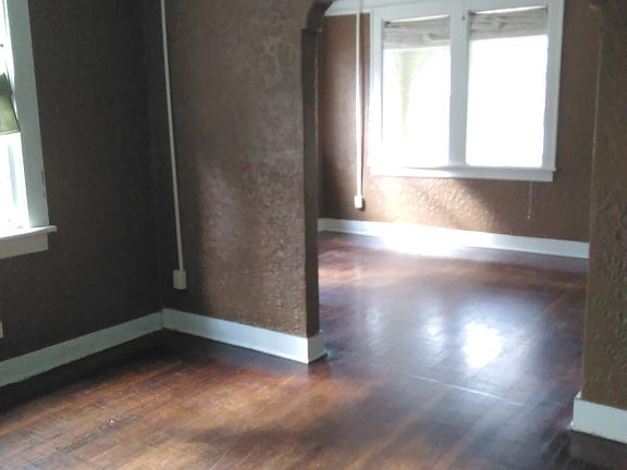 looking from dining room into living room and sun room is be