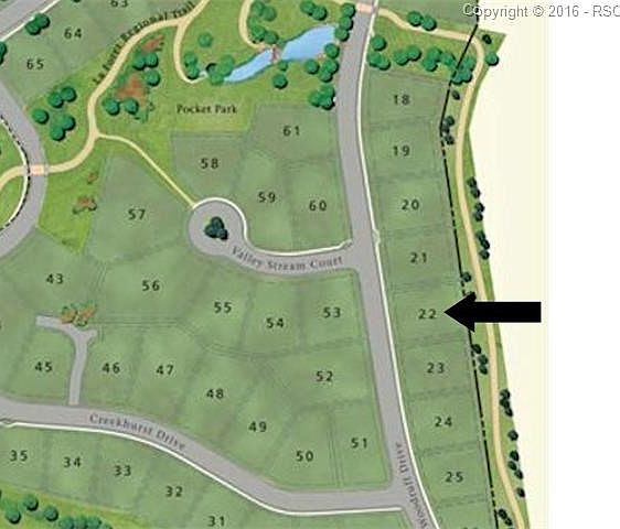 lot faces to the west and backs to walking path.