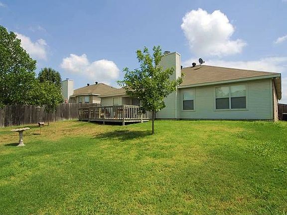 Nice backyard with wood deck.