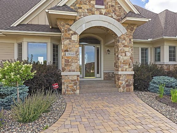 Inviting front entry has covered area to keep your guests dry and a large airlock to keep your foyer warm.