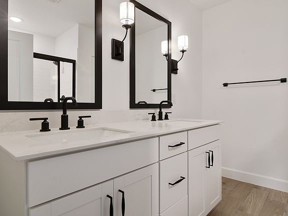 Primary bath with white freestanding vanity