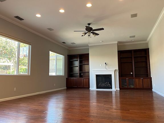 Oversized family room with built in bookshelves and media center. Gas fireplace will keep you cozy