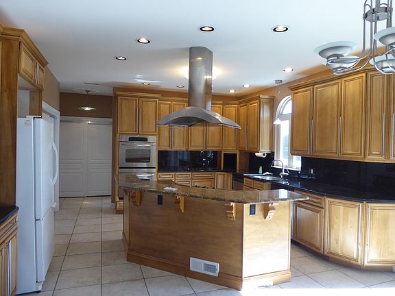 Kitchen. Dining room is nearby, but kitchen can accommodate a small table under hanging lights.