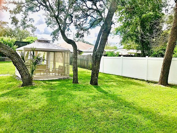 Fenced backyard with gazebo