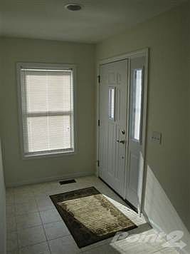 The foyer is large and tiled for easy clean-up when guests leave.  A coat closet is off to the right of the front door.