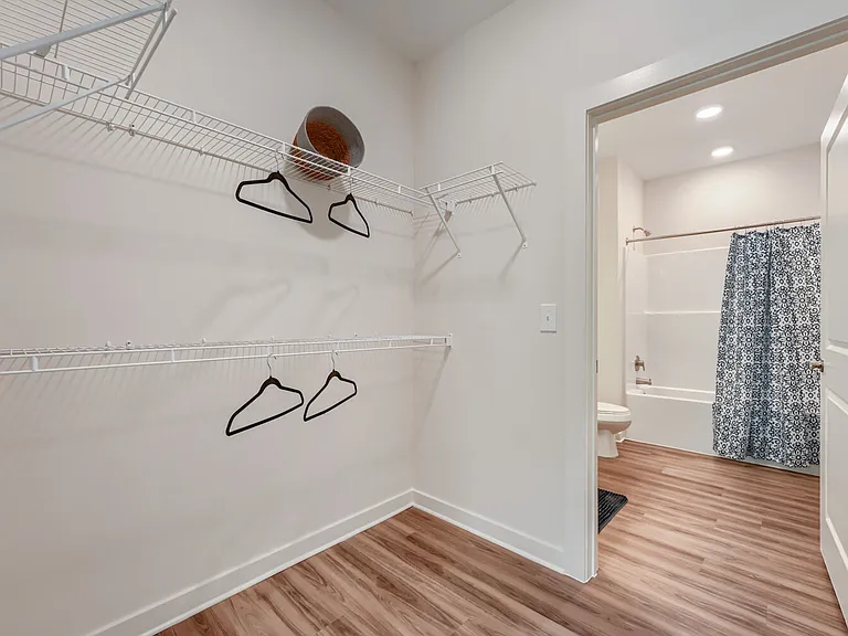 Walk in closet leading to bathroom