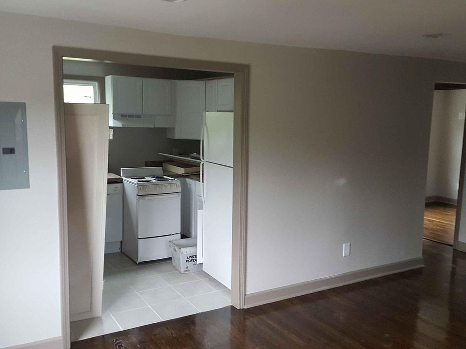 front o fhouse in LR to kitchen and back bedroom