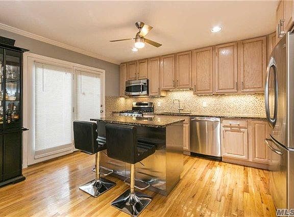 Kitchen W/Doors Leading To Private Enclosed Patio