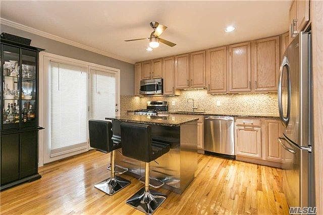Kitchen W/Doors Leading To Private Enclosed Patio