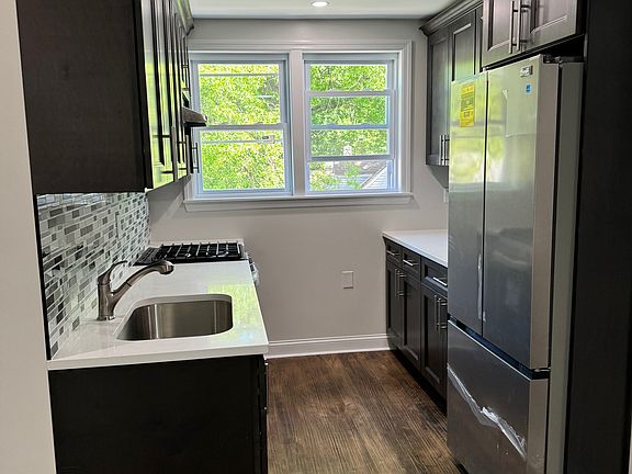 New Kitchen with Quartz Countertops and Stainless Steel Appliances