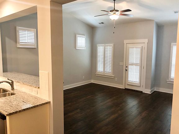 Open concept family room connected to kitchen & dining areas