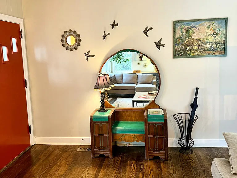 Living room front entry, one of a kind vintage drawered bench and original artwork