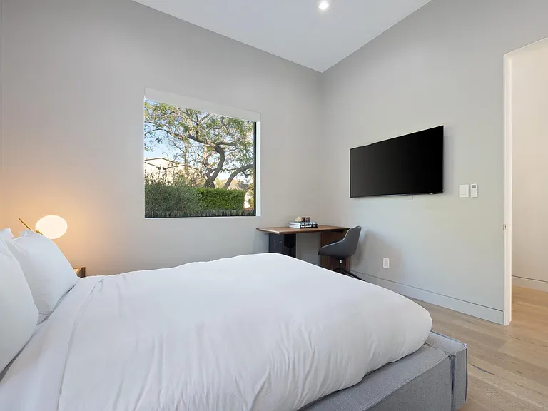 Relax on the soft bed infront of the flat screen TV