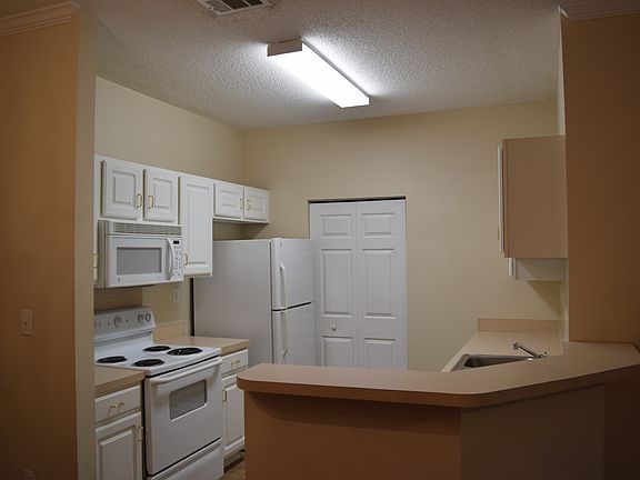 Kitchen with separate laundry room. Appliances included are