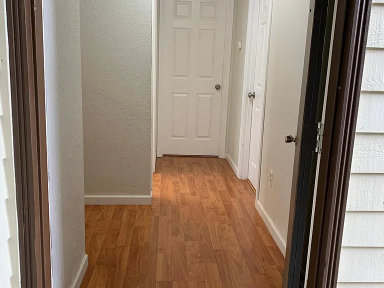 spacious entryway with both bedrooms tucked away privately on one side of the unit
