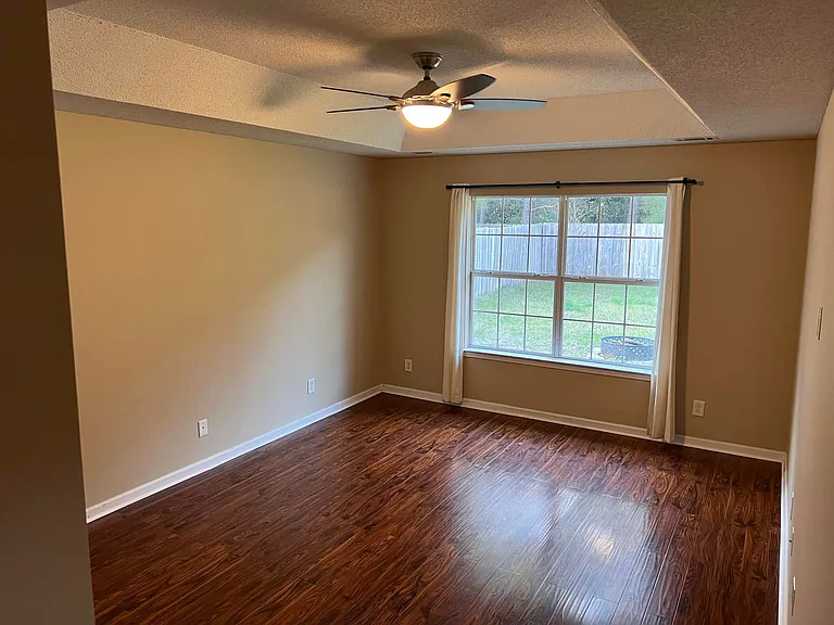 Master bedroom. Ceiling fan and light controlled by wireless remote control.