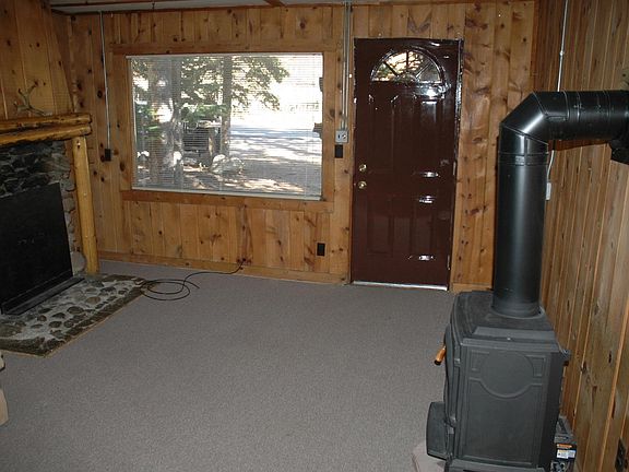 View from bedroom of living room and front door.