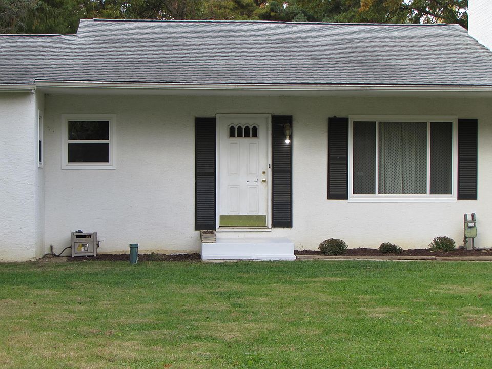Front entrance with deep covered entry.